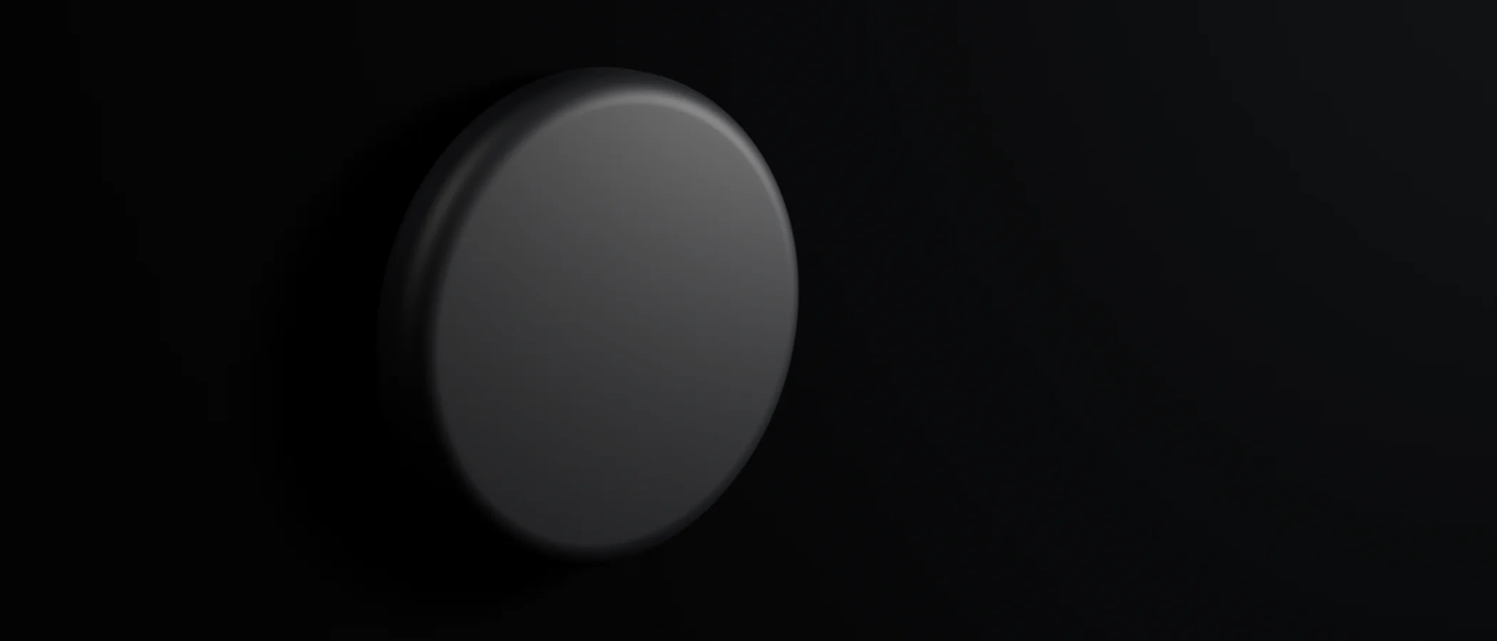 Cymo mounted flat on a dark wall, seen in a wide room view